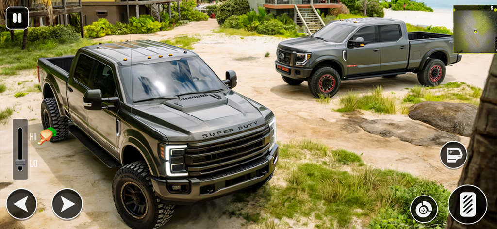 Two heavy duty pickup trucks on a sandy beach in an offroad simulator game.