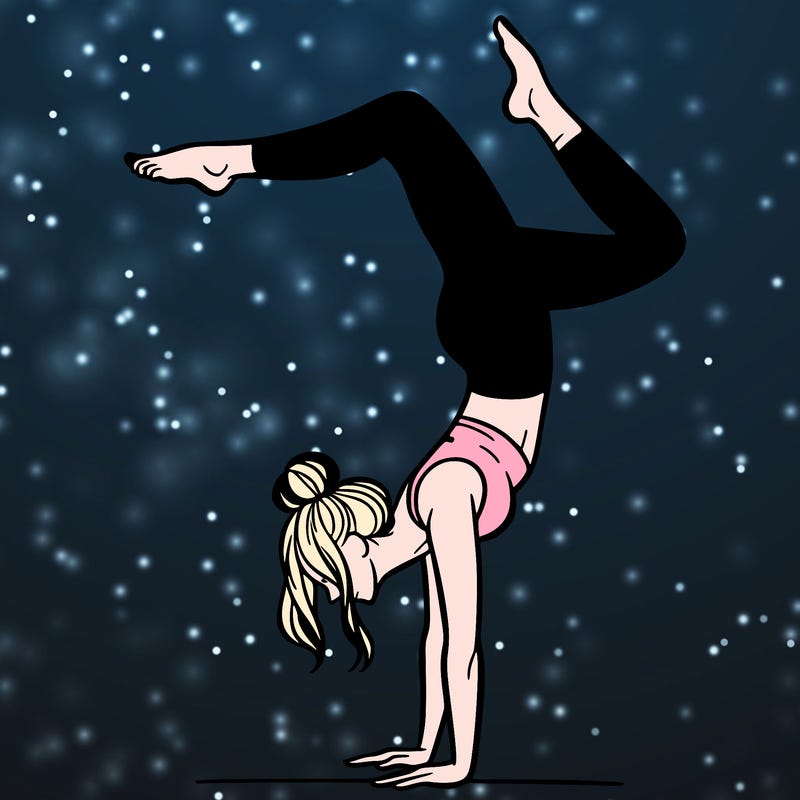 a woman doing a handstand