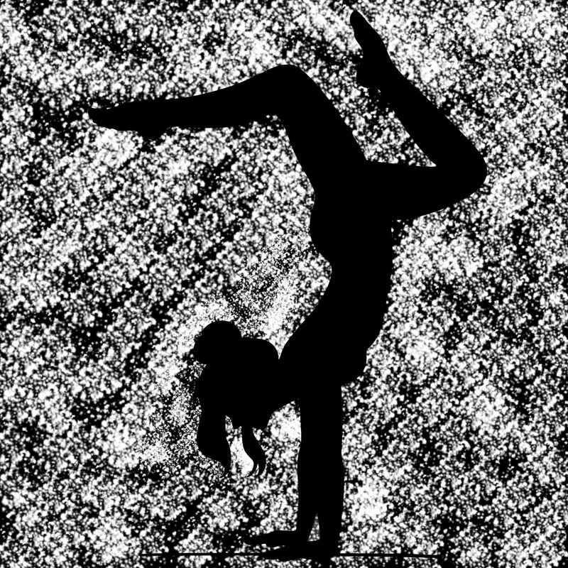 a woman doing a handstand