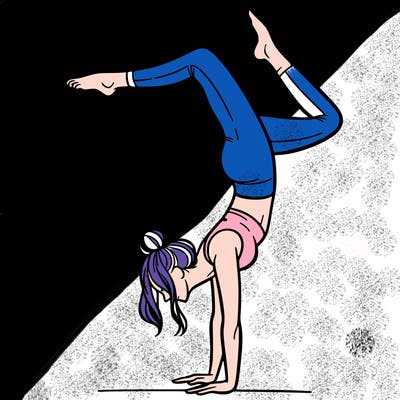 a woman doing a handstand