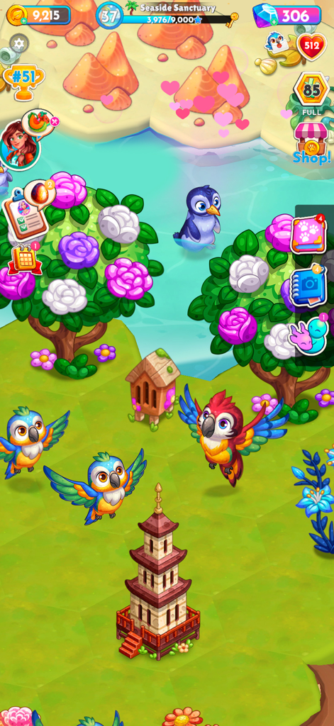 Gameplay screen of Paradise Paws showing colorful parrots and a penguin in a lush animal sanctuary