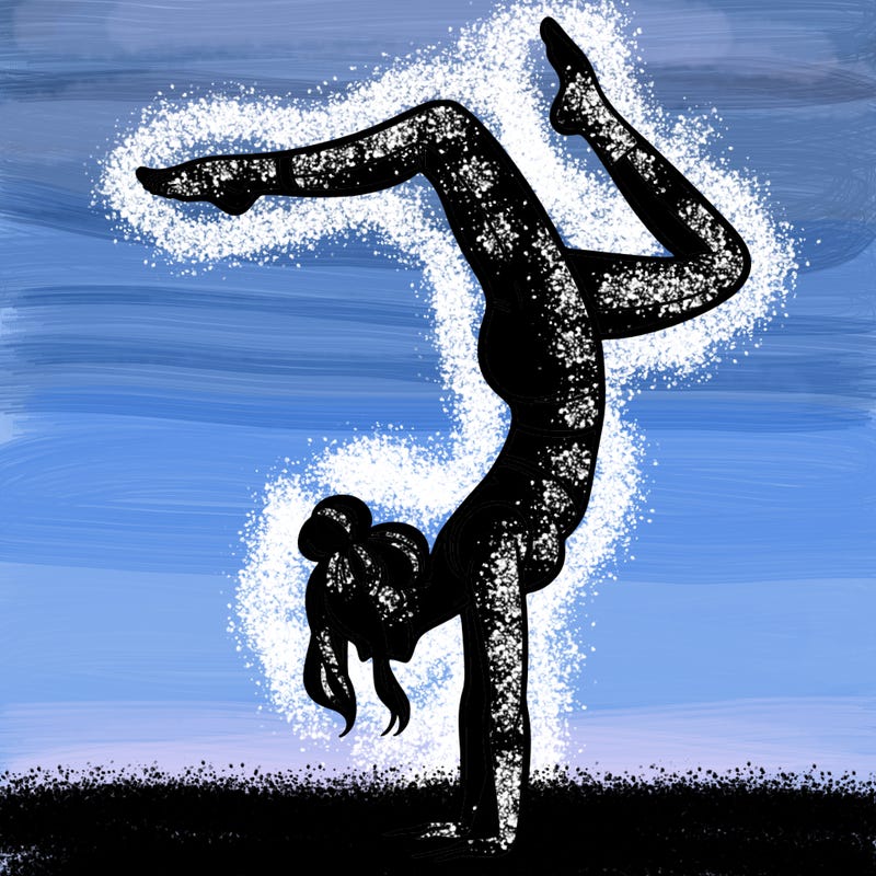 a woman doing a handstand