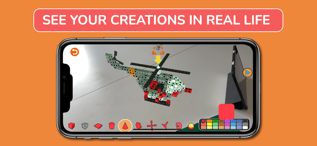Blox 3Dインターフェースを備えた拡張現実環境で、ブロックで作られた3Dヘリコプターを表示するスマートフォン