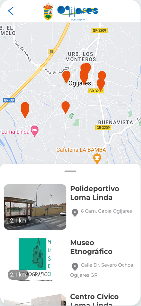 Map view of the Ogijares app showing location markers for the sports center and ethnographic museum.