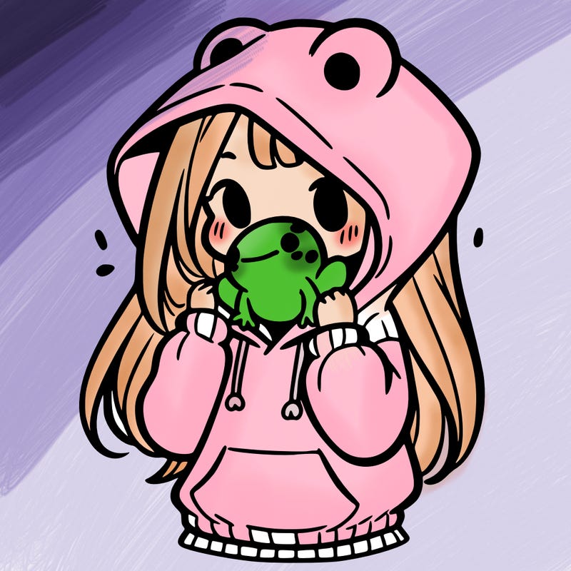 a girl holding a froggy hoodie