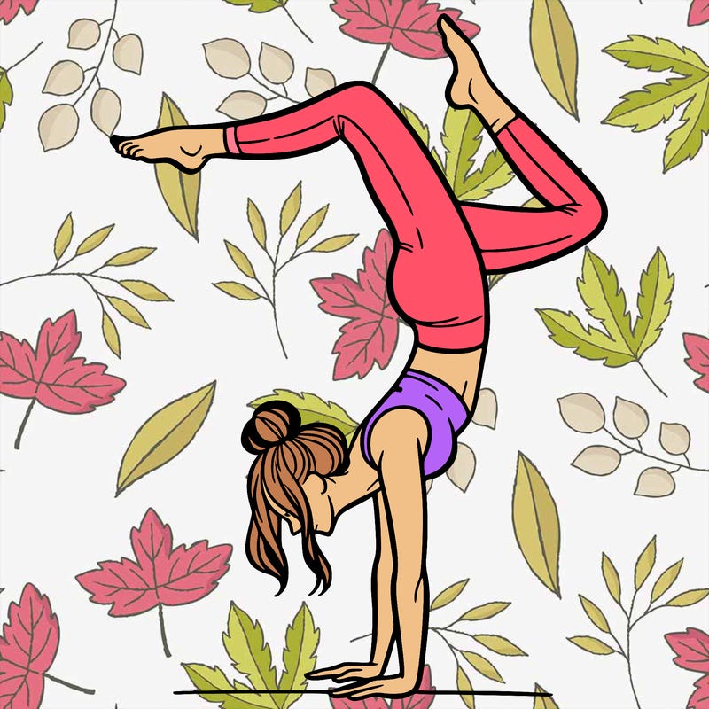 a woman doing a handstand