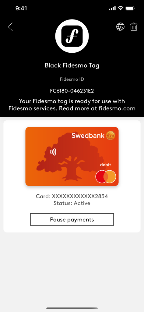 Fidesmo app interface displaying an active Swedbank debit card linked to a Black Fidesmo Tag with a pause payments option