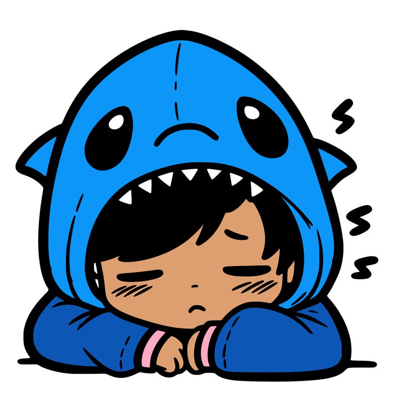 tired boy in shark hoodie