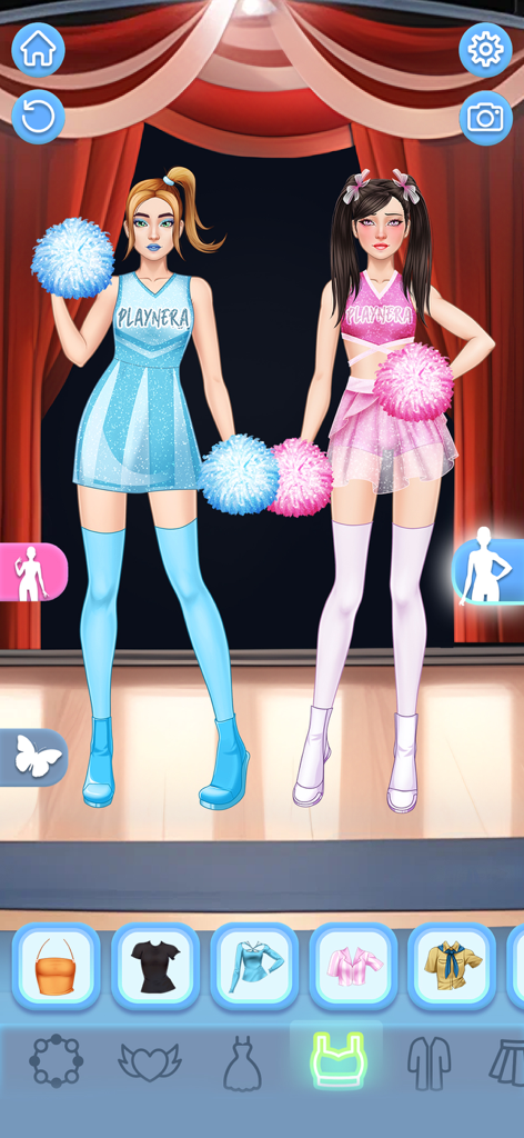 BFF Dress Up Games for Girls - Dos modelos de chicas con atuendos de porrista en azul y rosa con pompones en un juego de moda de vestir