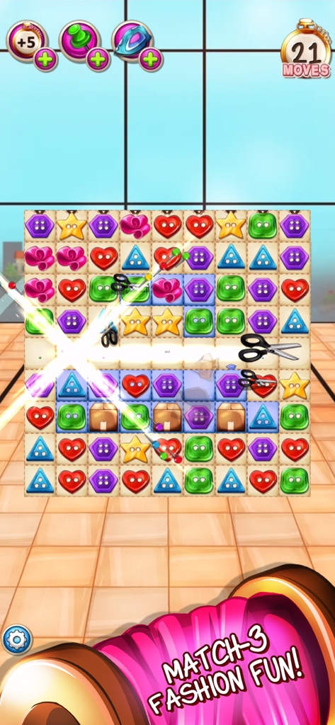 A colorful match-3 puzzle board from Fancy Tale featuring button-shaped pieces and tailoring tools.