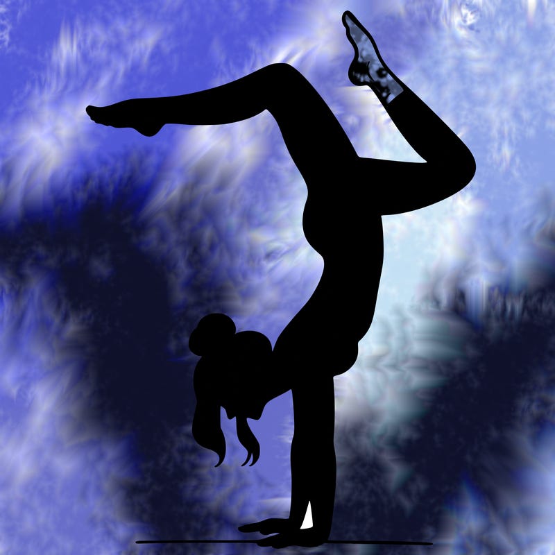 a woman doing a handstand