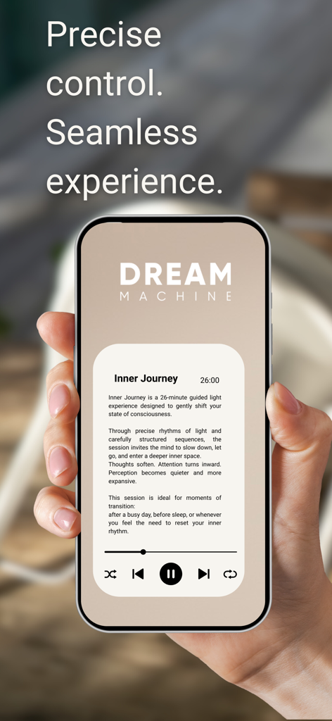 Dream Machine - A hand holding a smartphone displaying the Dream Machine app with a guided light session called Inner Journey