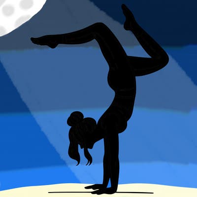 a woman doing a handstand