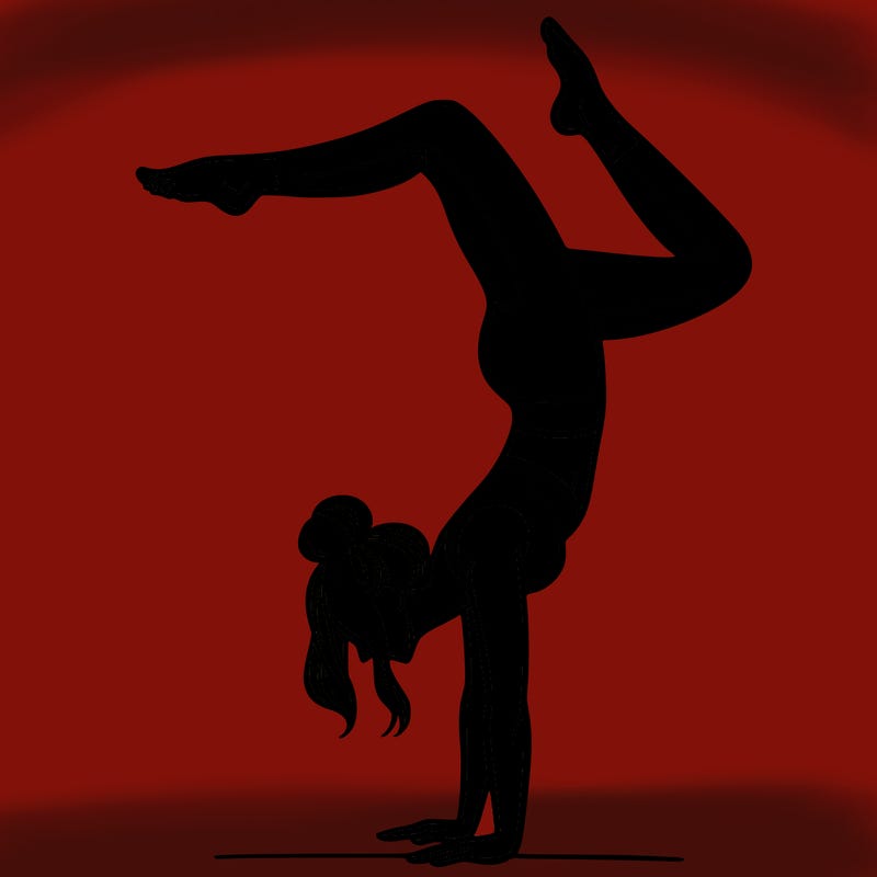 a woman doing a handstand