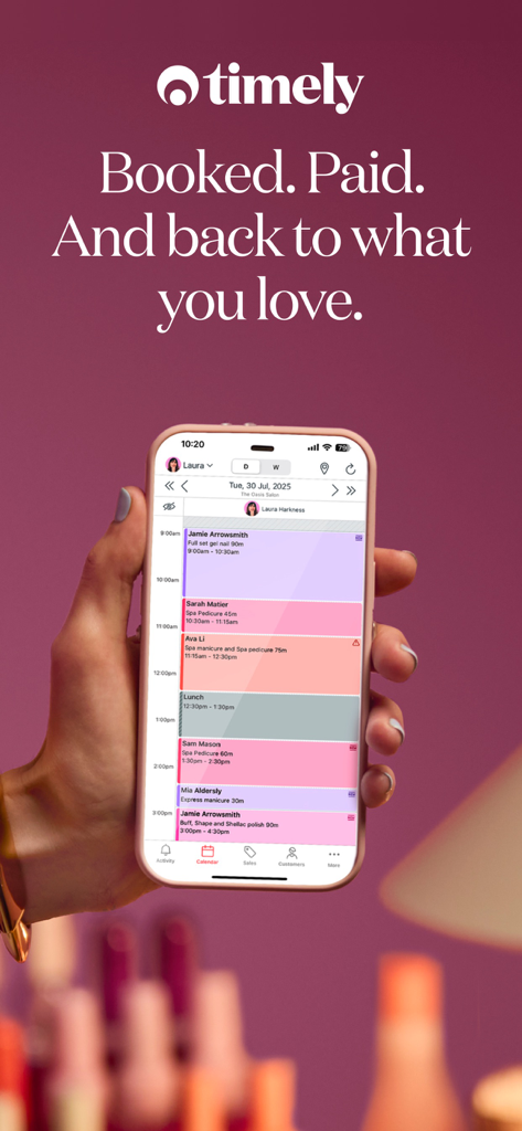 Timely – Bookings & payments - A hand holding an iPhone displaying the Timely app daily booking schedule for a hair salon