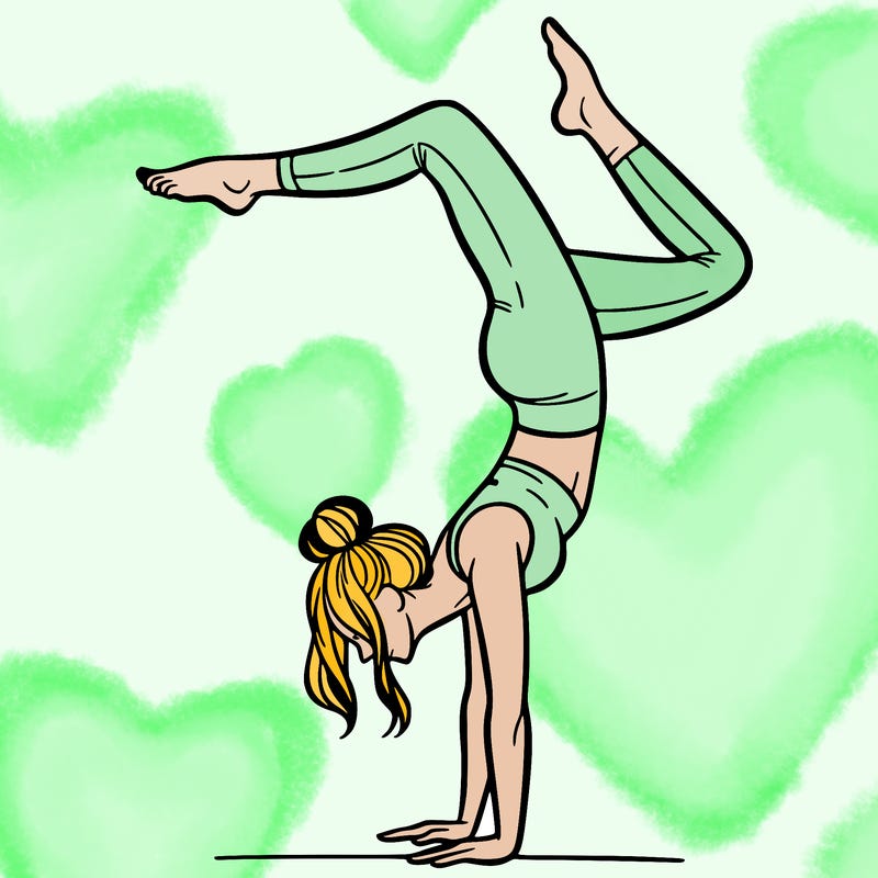 a woman doing a handstand