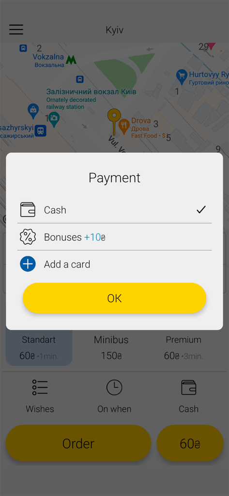 Taxi 9192 mobile app interface showing a payment method selection popup with options for cash bonuses and adding a bank card over a map of Kyiv