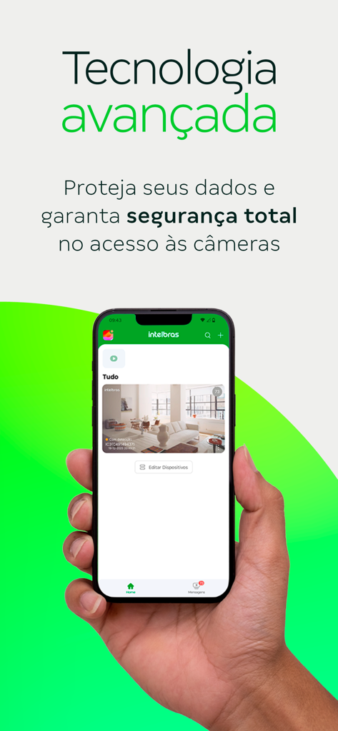 A hand holding a smartphone displaying the Intelbras Mibo app interface with a live security camera feed of a living room.