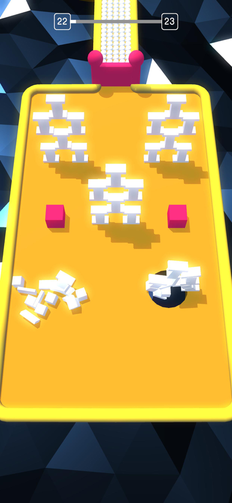 Captura de pantalla de un juego móvil que muestra un agujero negro tragando bloques 3D blancos en una pista amarilla mientras evita obstáculos rosas