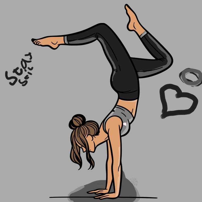 a woman doing a handstand