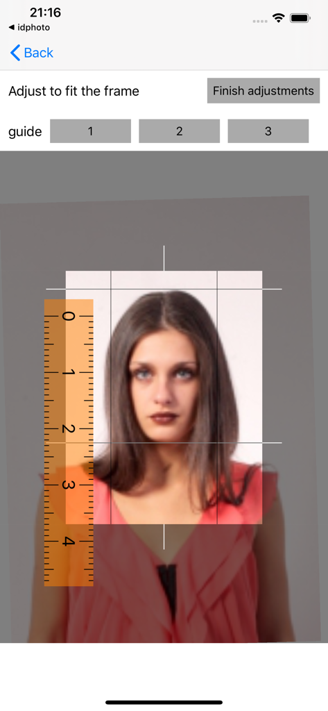 ID Photo application - Adjusting a portrait photo using a ruler and grid guide for passport photo compliance