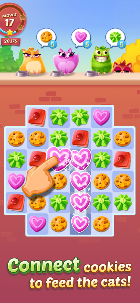 Cookie Cats™ - A hand connecting pink heart cookies to feed hungry cartoon cats in the Cookie Cats mobile game.