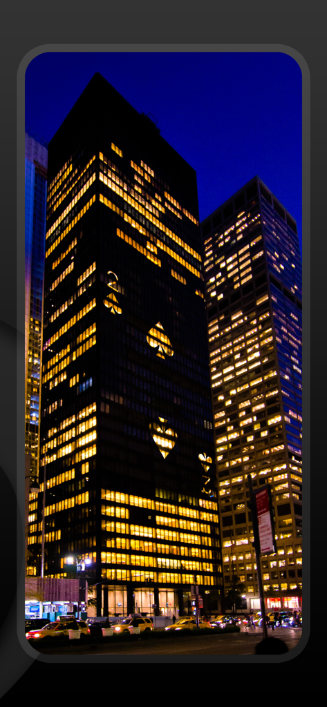 Stigma 4 - Magic Trick Tricks - A city skyscraper at night with windows lit up to form the two of spades playing card