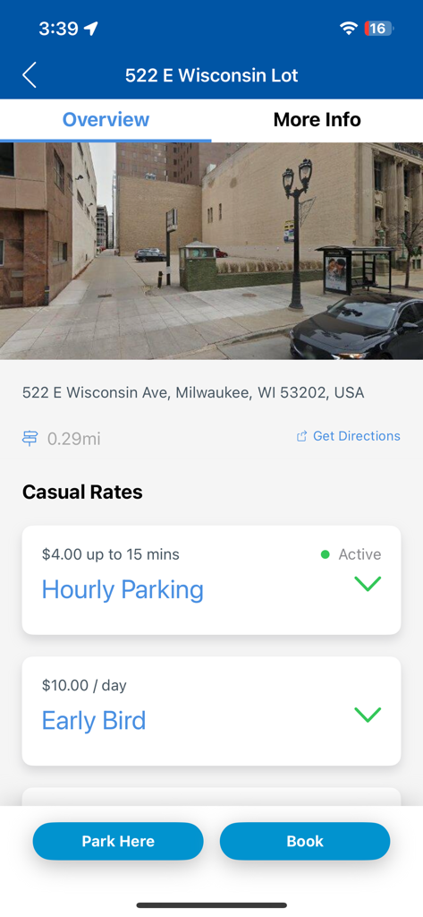Secure-a-Spot mobile app displaying hourly and early bird parking rates for a lot in Milwaukee