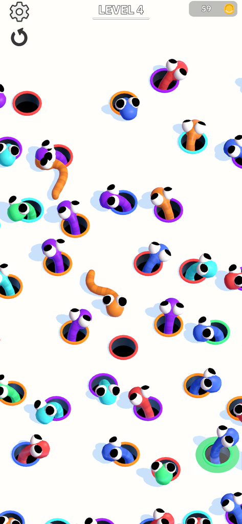 Hole Worm - Gameplay of Hole Worm showing colorful worms with big eyes being matched to corresponding colored holes