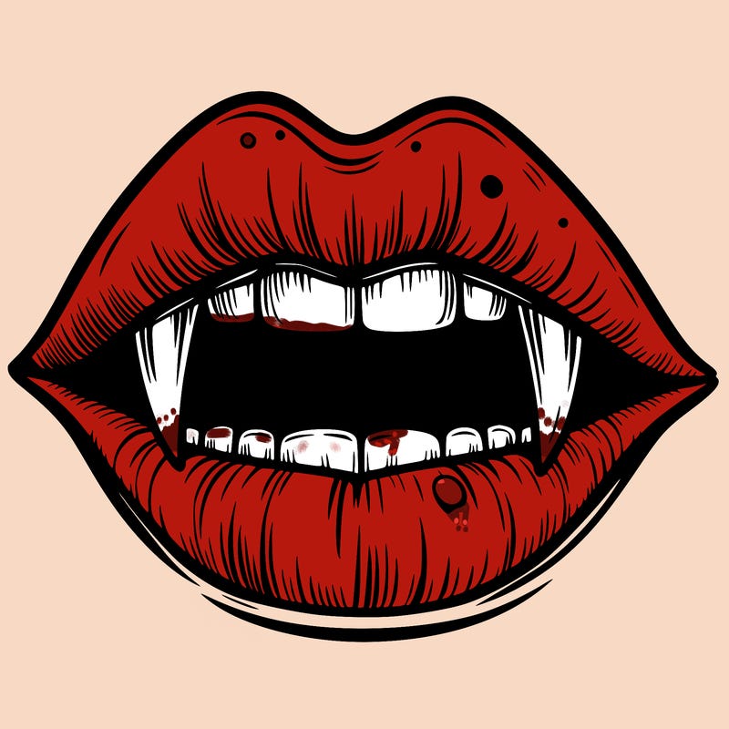 lips with vampire teeth