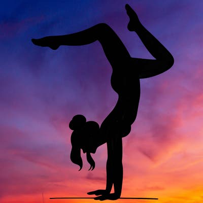 a woman doing a handstand