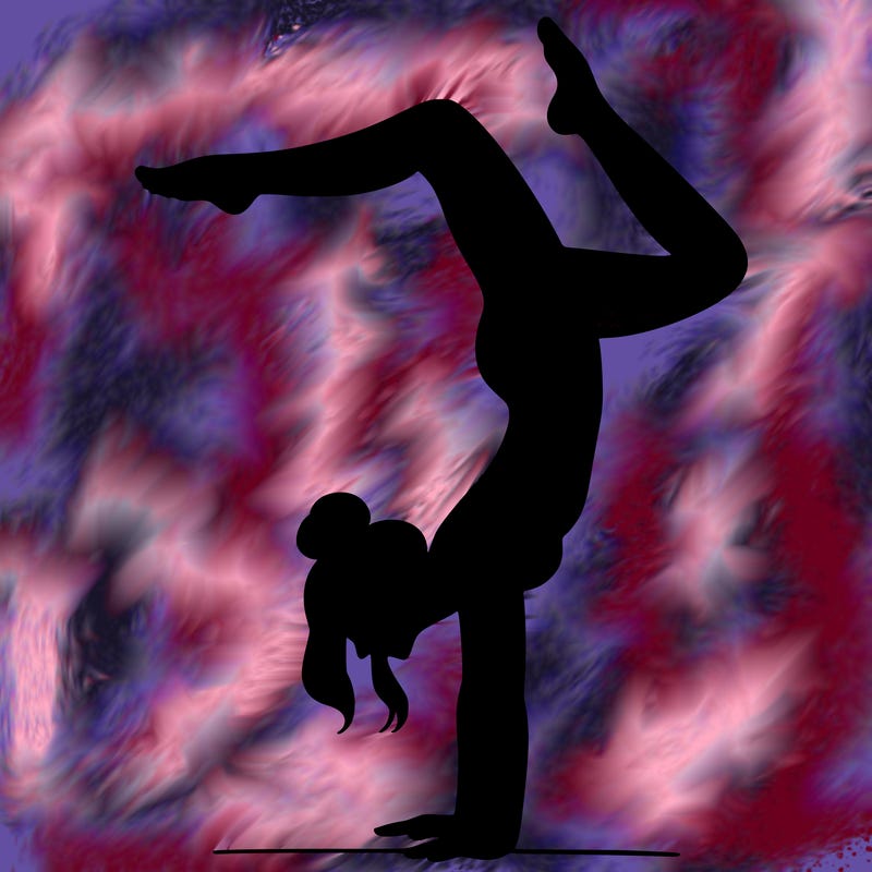 a woman doing a handstand