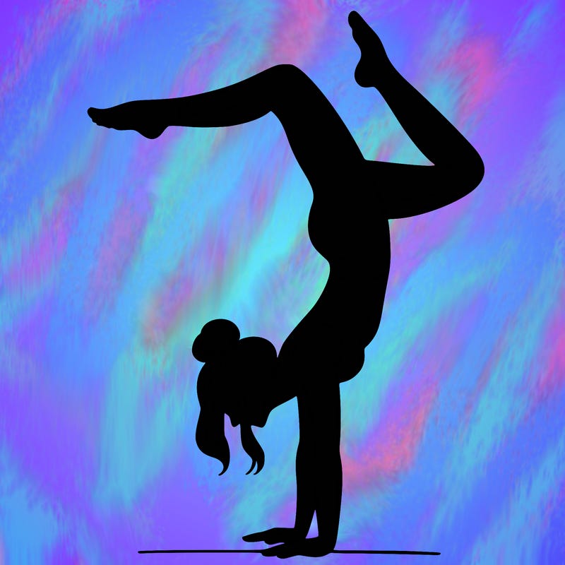 a woman doing a handstand