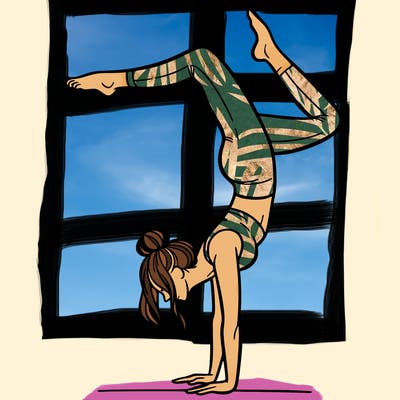 a woman doing a handstand