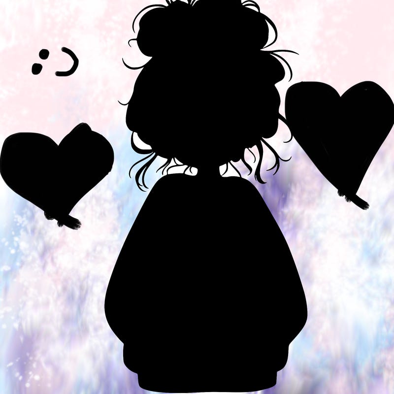 girl with baggy sweatshirt and messy bun