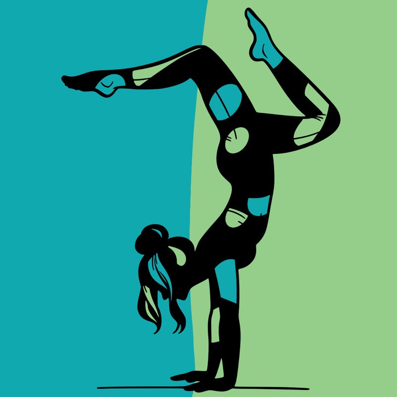 a woman doing a handstand