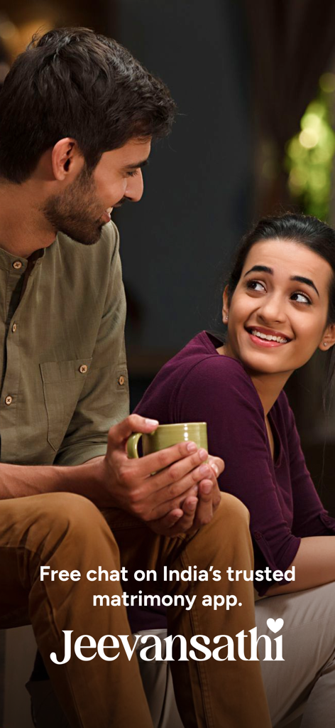 A smiling Indian couple talking over coffee on Jeevansathi matrimony app