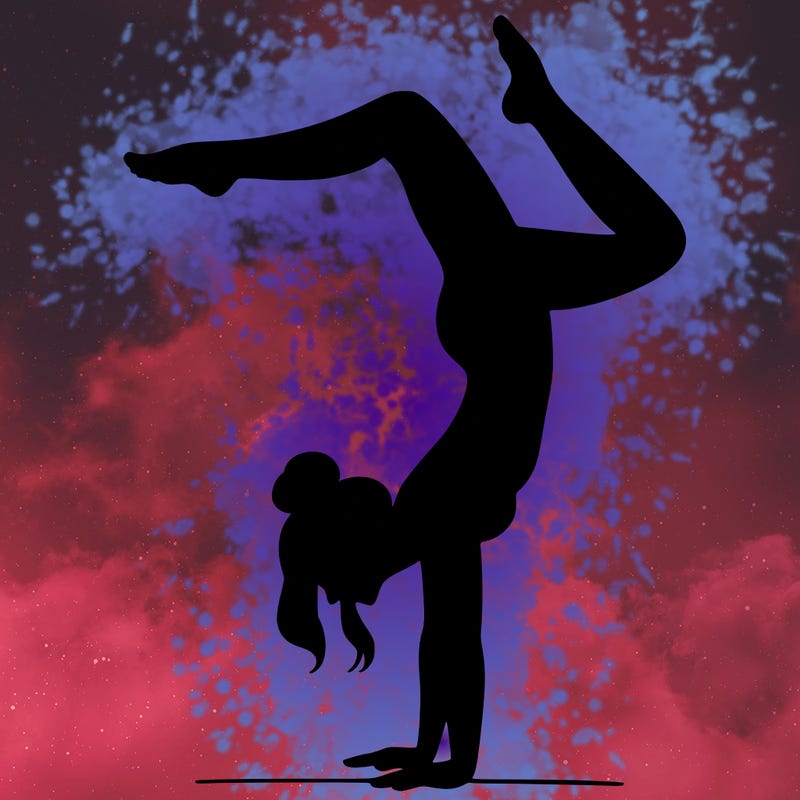 a woman doing a handstand