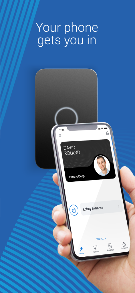 A person holding a smartphone with a digital security badge to unlock a door reader using the Avigilon Alta Open app