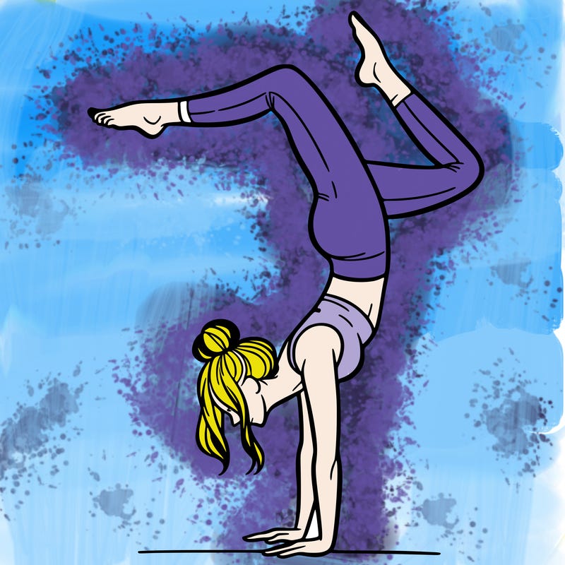 a woman doing a handstand