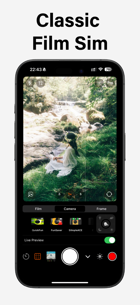 iPhone screen showing Vibe Cam app interface with classic film simulation filters and a woman sitting in a forest by a stream.