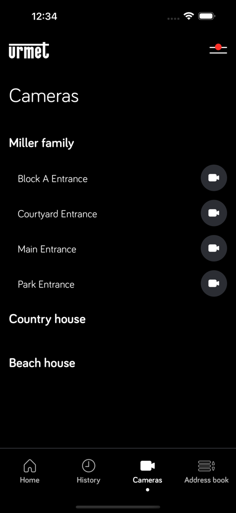 Urmet CallMe Uin - Interface do aplicativo Urmet CallMe Uin mostrando uma lista de locais de câmeras de segurança para várias propriedades