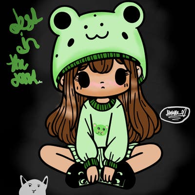 a girl wearing a frog hat and some frog socks