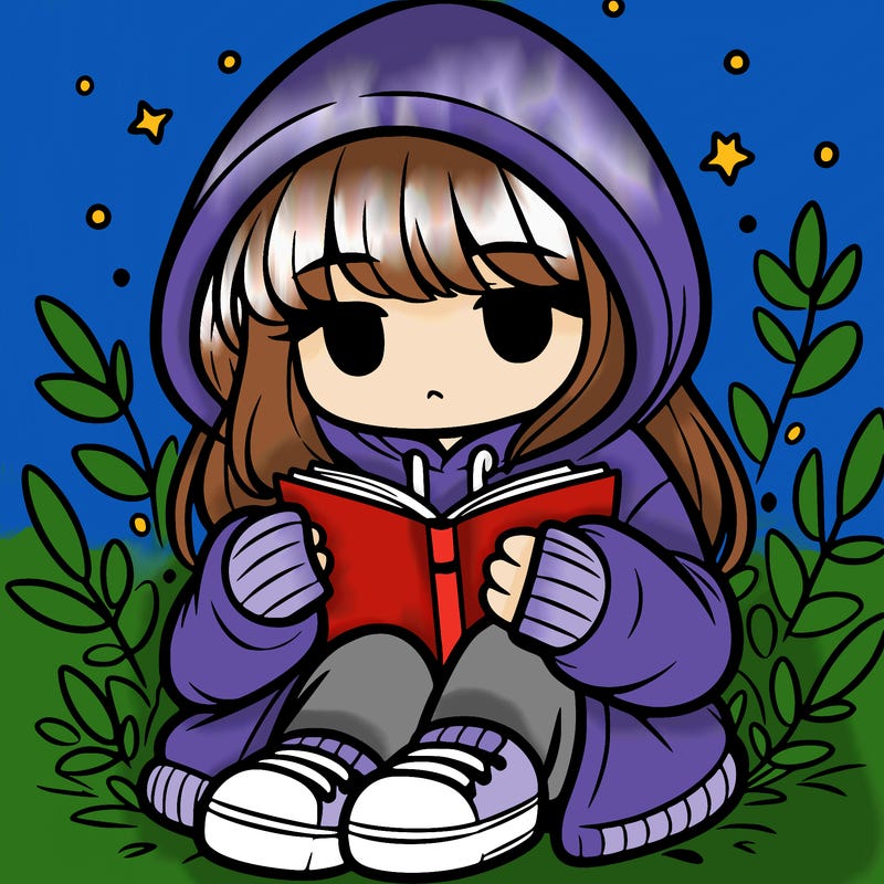 girl in oversized hoodie reading a book