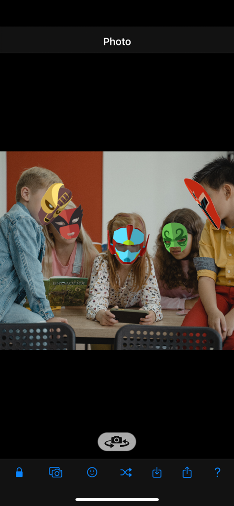AR Mask - A group of children sitting together wearing colorful digital superhero masks applied through the AR Mask app interface.