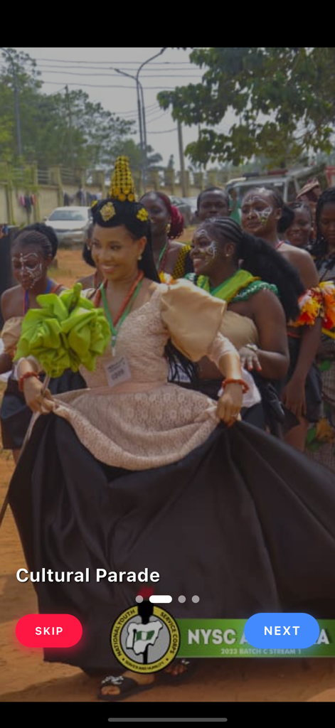 NYSC Official - An onboarding screen of the NYSC Official app showing a group of people in traditional Nigerian attire during a cultural parade.