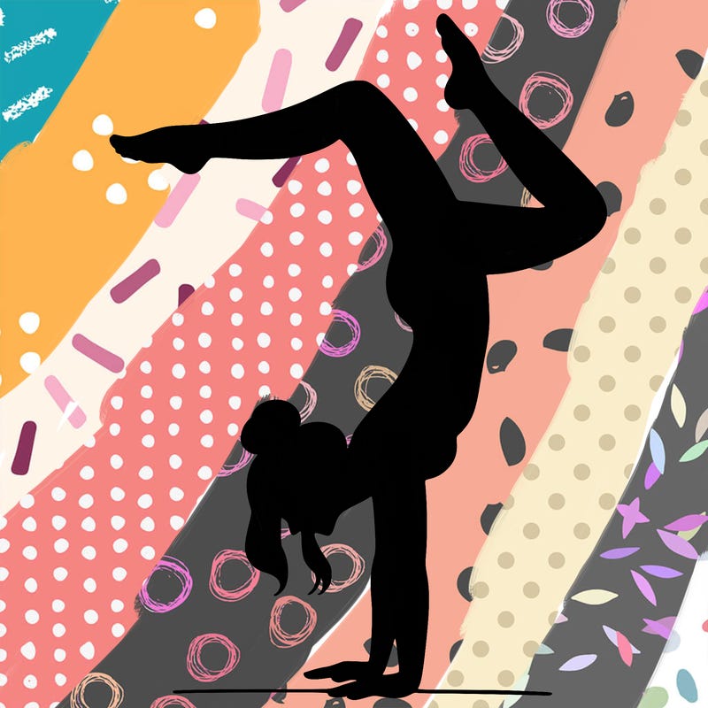 a woman doing a handstand