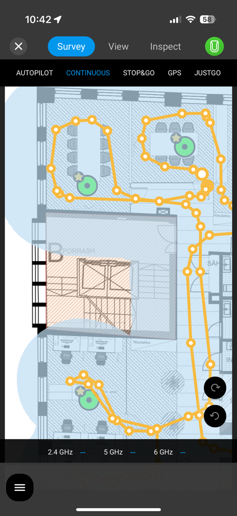 Ekahau Survey - Ekahau Survey mobile app interface displaying a Wi-Fi signal heatmap and survey path on a professional building floor plan.