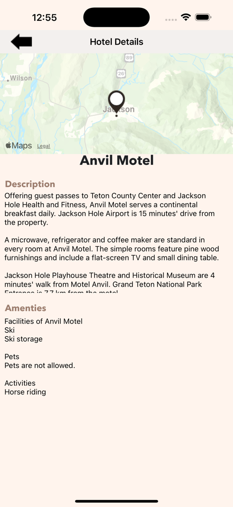 A mobile screen showing hotel details for Anvil Motel including a map, room description, and available amenities.