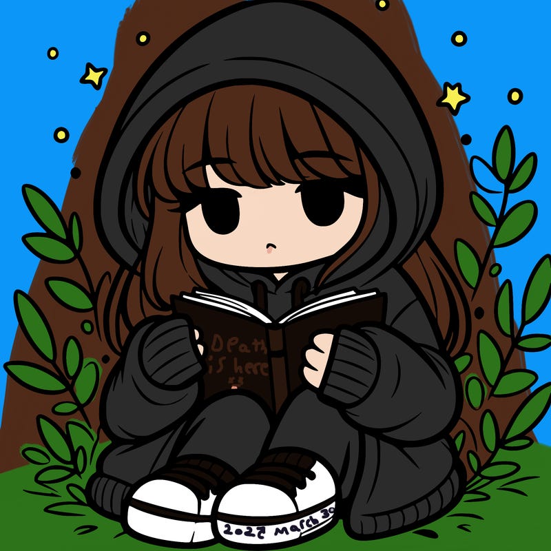 girl in oversized hoodie reading a book